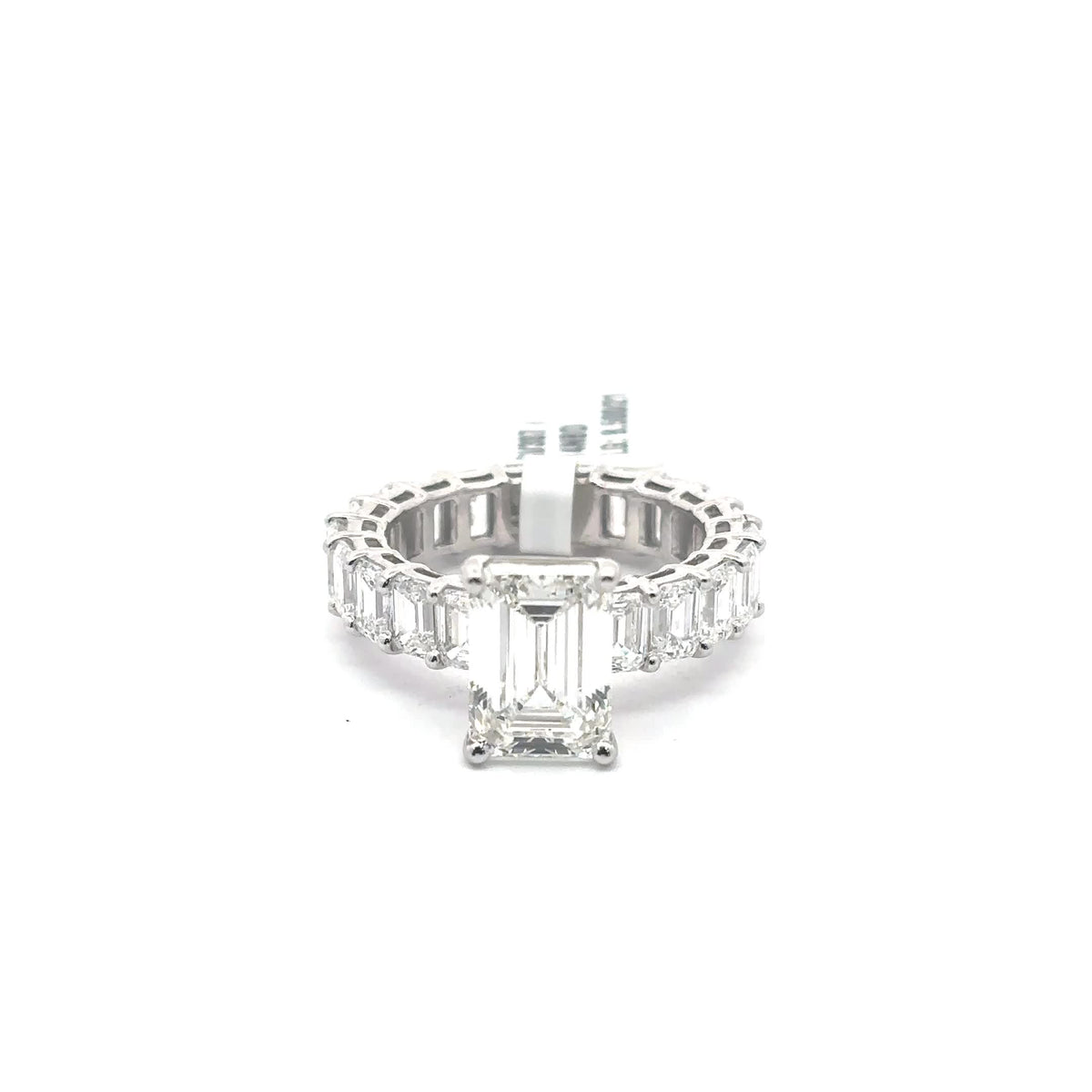 The Marguerite emerald-cut solitaire on emerald eternity band in 14K white gold