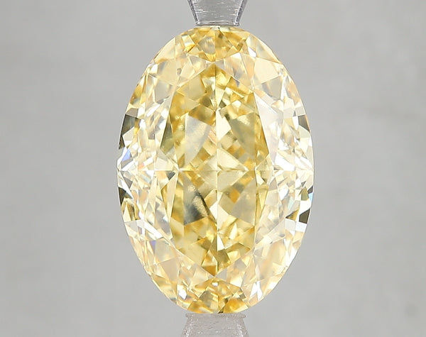 5.16ct Fancy Intense Yellow Oval Lab Diamond, VVS2, IGI Certified