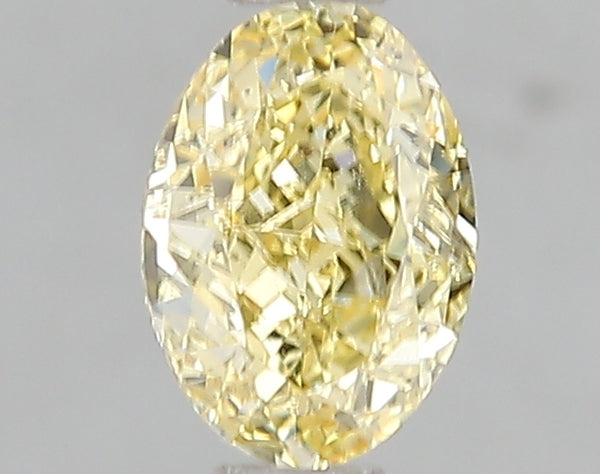 1.01ct Fancy Intense Yellow Oval Lab Diamond, VS1, IGI Certified