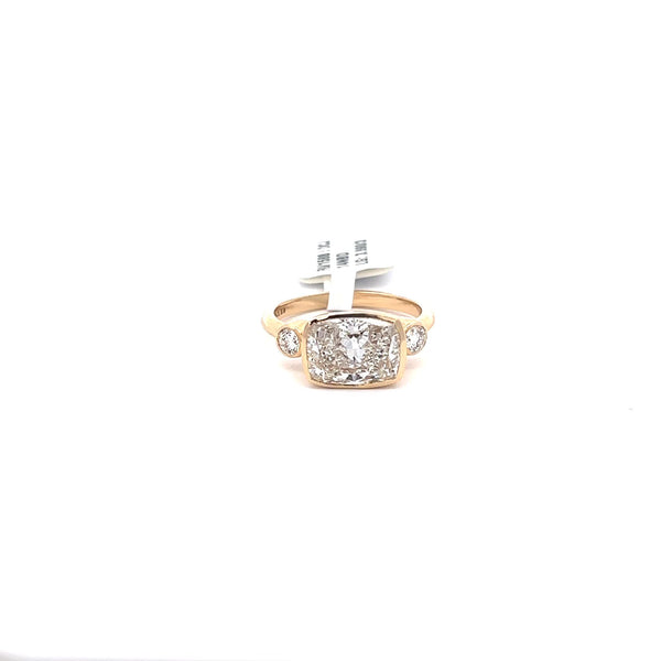 The Lucie East-West Cushion Three-Stone Ring