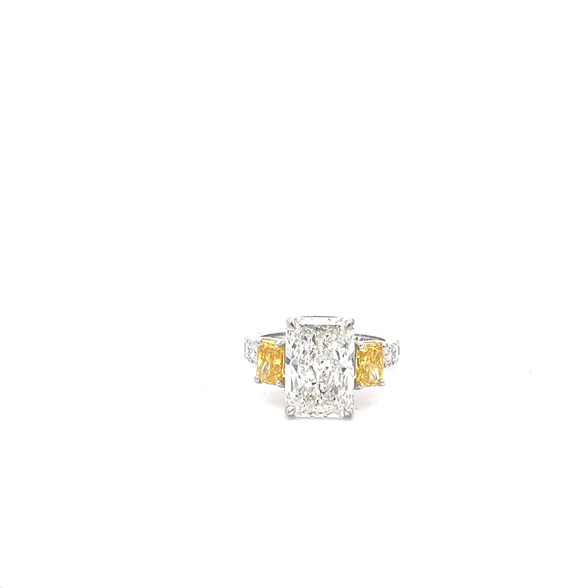 The Ophelie radiant ring with fancy yellow radiant sides in 14K white gold
