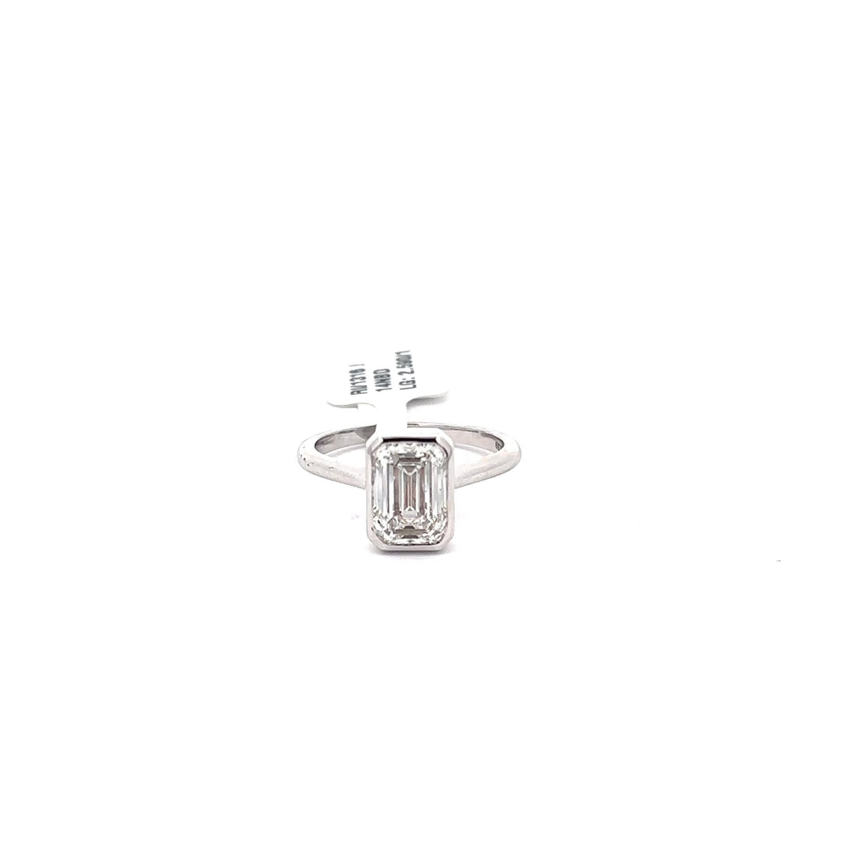The Romy emerald bezel solitaire ring in 14K white gold