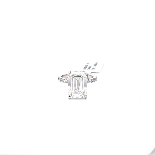 The Honorine emerald-cut hidden-halo solitaire ring in 14K white gold