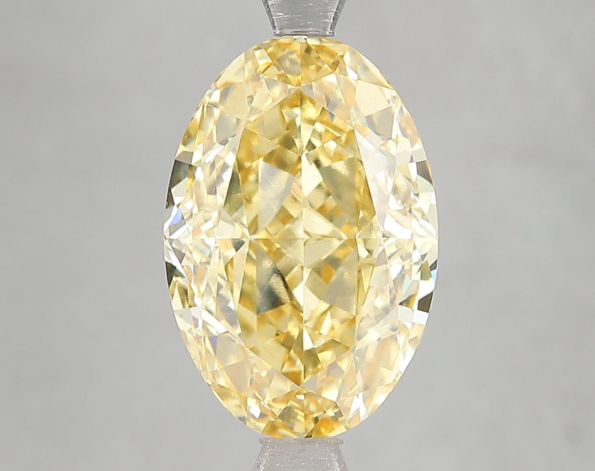 5.16ct Fancy Intense Yellow Oval Lab Diamond, VVS2, IGI Certified
