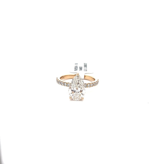 The Liliane pear hidden-halo solitaire ring in 14K yellow gold