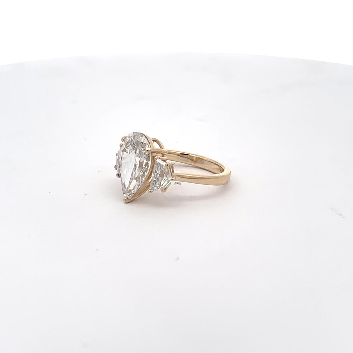 The Delphine Pear Three-Stone Ring