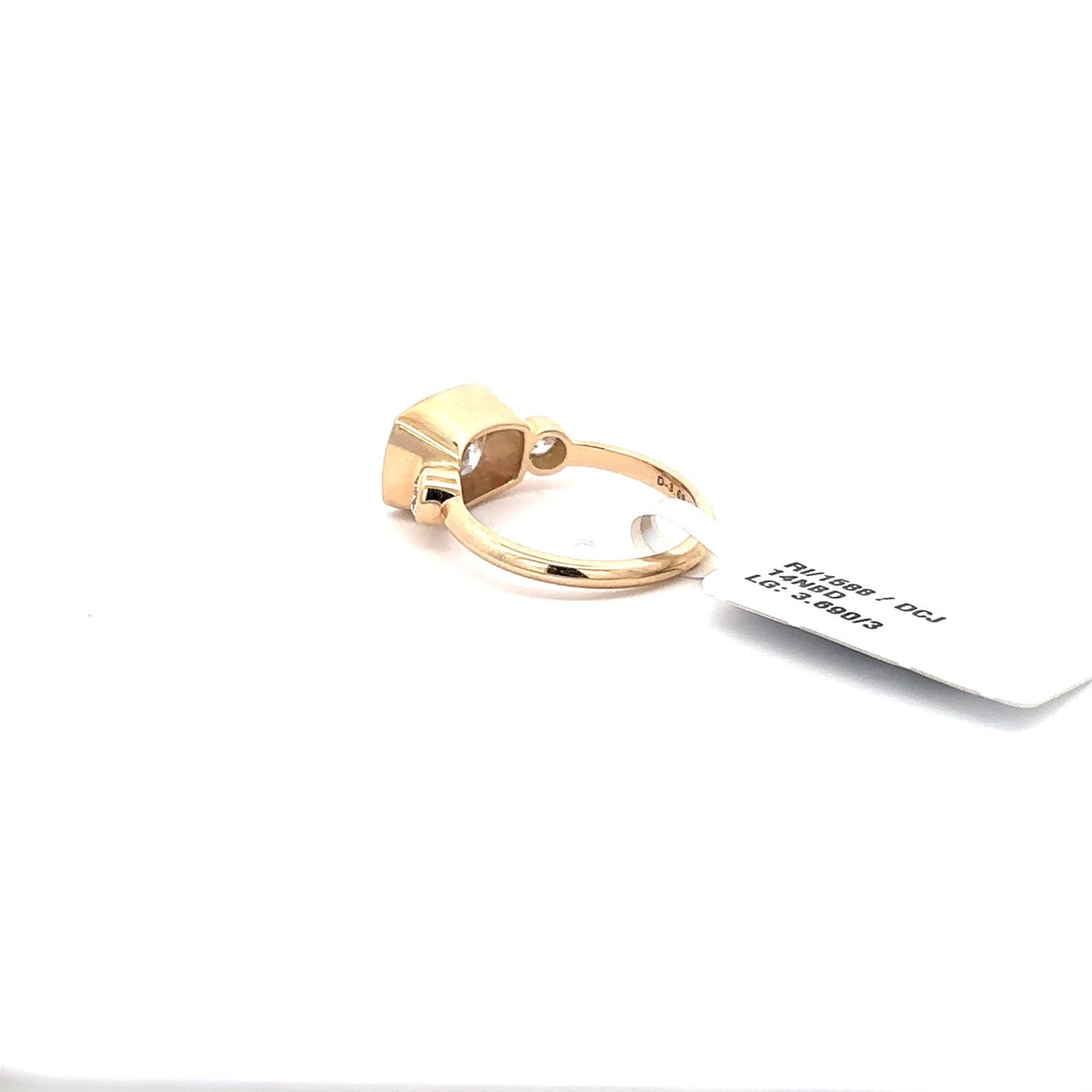 The Lucie East-West Cushion Three-Stone Ring