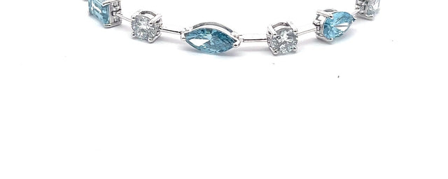 The Capri fancy blue and white diamond tennis bracelet in 14K white gold