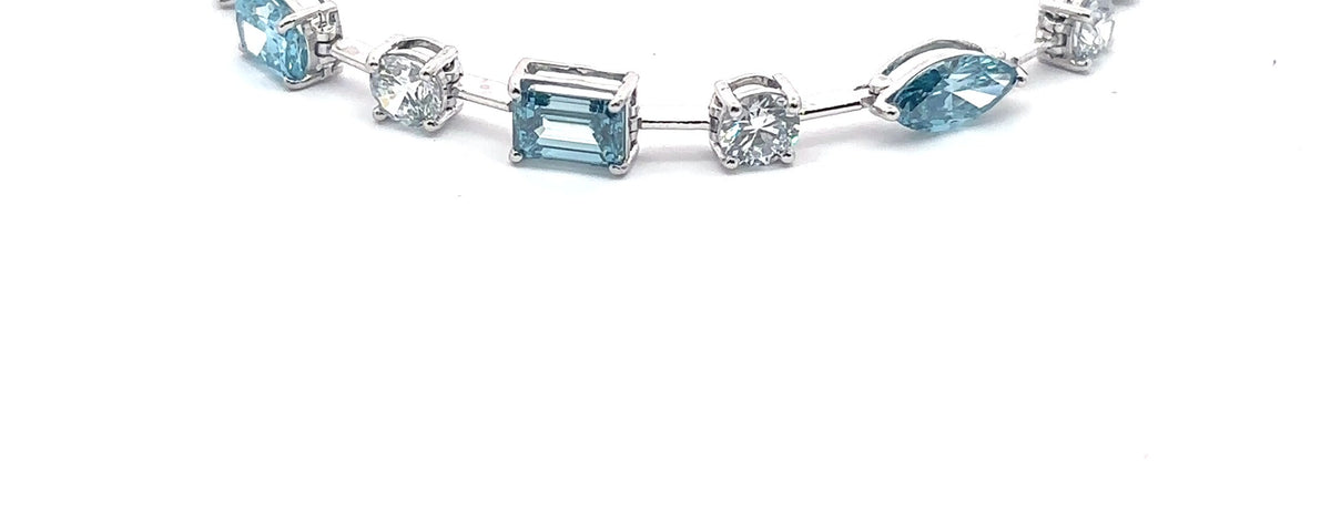 The Capri fancy blue and white diamond tennis bracelet in 14K white gold