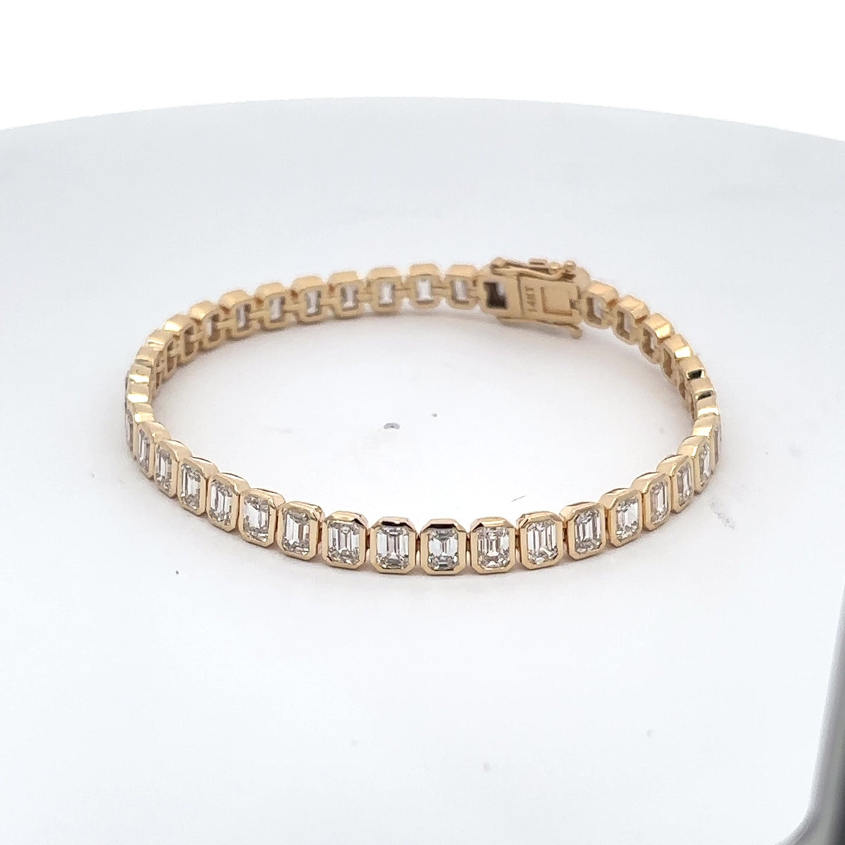 The Capucine bezel-set emerald-cut diamond tennis bracelet in 14K yellow gold