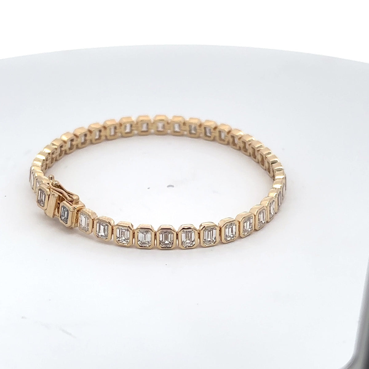 The Capucine bezel-set emerald-cut diamond tennis bracelet in 14K yellow gold