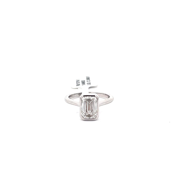 The Romy emerald bezel solitaire ring in 14K white gold