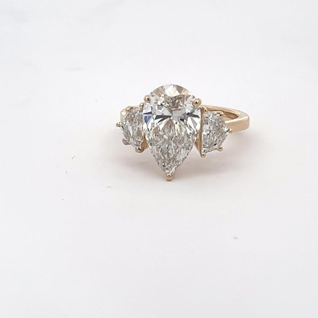 The Delphine Pear Three-Stone Ring