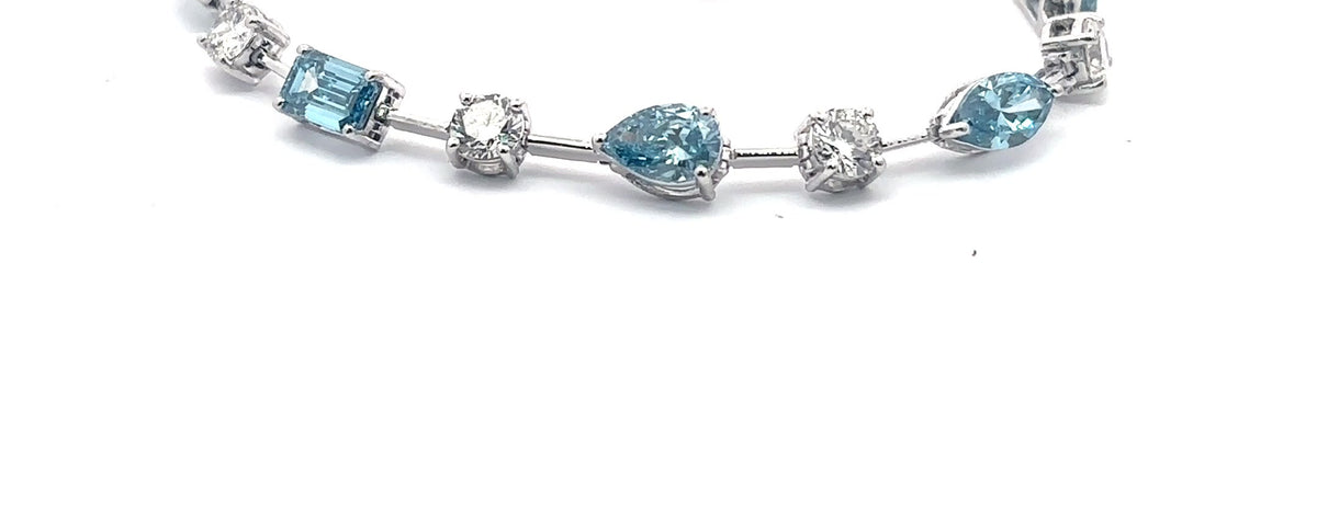 The Santorini fancy blue and white diamond tennis bracelet in 14K white gold